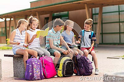 Group of happy elementary school students outdoors Stock Photo