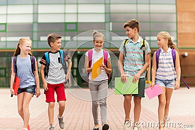 Group of happy elementary school students walking Stock Photo