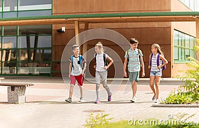 Group of happy elementary school students walking Stock Photo