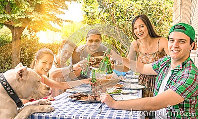 Group of happy friends eating at garden Stock Photo