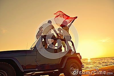 Group of happy friends making party in car - Young people having fun drinking champagne Stock Photo