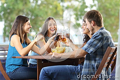 Group of happy friends toasting Stock Photo