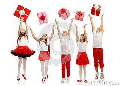 Group of happy kids in Christmas hat catching gift Stock Photo