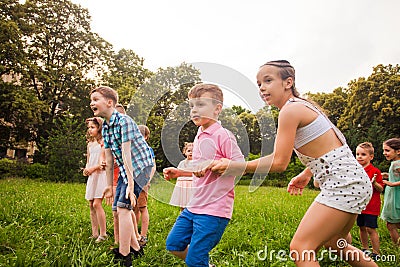 Group of happy kids playing games in summer camp Stock Photo