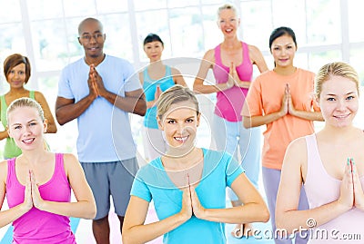 Group Of Happy Multi-Ethnic People In A Yoga Class Stock Photo