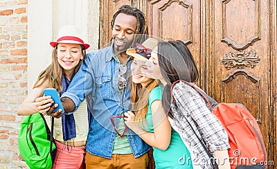 Group of happy multiracial friends taking selfie with mobile phone Stock Photo