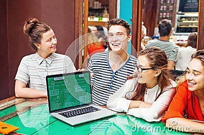 Group of happy people with laptop in cafe Stock Photo