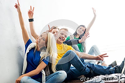 Group of happy students on a break waving Stock Photo