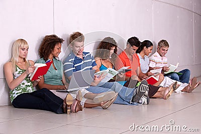 Group of happy students studying Stock Photo