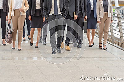 Group of happy young business team, businesspeople walking the outdoor office together Stock Photo