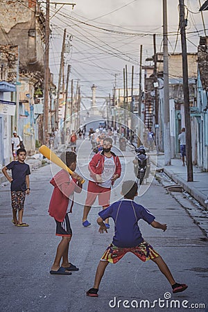 Group of happy, young children playing in the street in a vibrant Cuban neighborhood Editorial Stock Photo