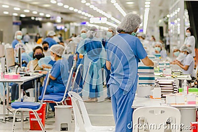 Group of health care team preparing vaccine against covid-19. Editorial Stock Photo