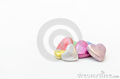 Group of hearts of different colors together on white background. Stock Photo