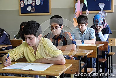 Group of high school students taking a test in classroom. Editorial Stock Photo