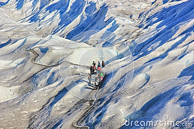 Group of hiker people making amazing trekking at ice surface of Perito Moreno Glacier, Patagonia Argentina, Editorial Stock Photo