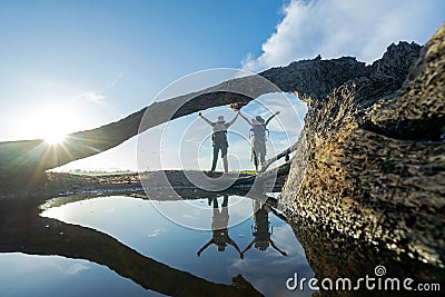 Group hiker woman travel and explore adventure raise hands in nature. Stock Photo