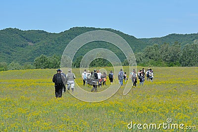 Group of hikers walk in nature Editorial Stock Photo