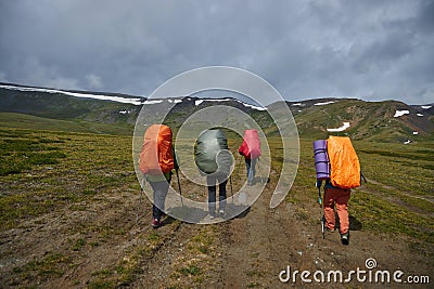 Group hiking, multi-day backpacking. Hiking in the Altai mountains, amazing landscape of the valley of the mountain range. Russia Editorial Stock Photo