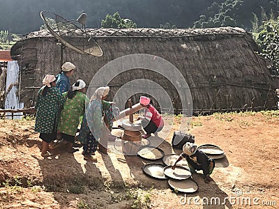 Group of hill tribe women in northern of Thailand are pounding r Editorial Stock Photo