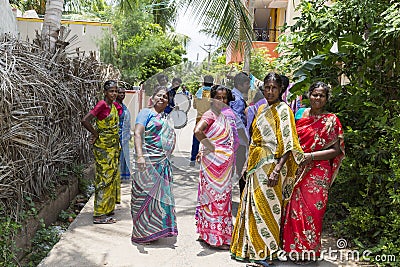 A Group of Hindu Indian Women Wearing Colorful Sari`s Walking Down a Street Editorial Stock Photo
