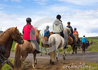 Group of horseback riders in Iceland. Travel beautiful country Editorial Stock Photo