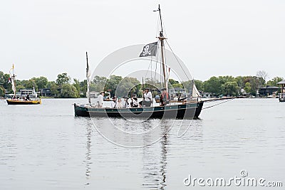 Group of individuals in pirate-themed costumes on a large sailboat in Orillia, Canada Editorial Stock Photo