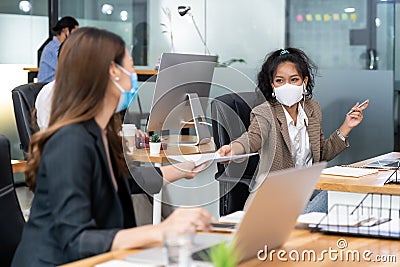 Social distance office with business team wear face mask as new normal life Stock Photo