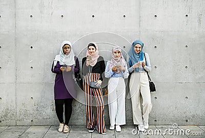 Group of islamic girls using smart phone Stock Photo