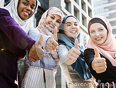 Group of islamic women gesturing thumps up Stock Photo