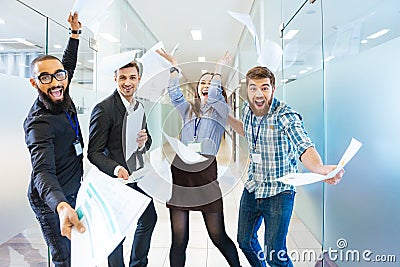 Group of joyful excited business people having fun in office Stock Photo