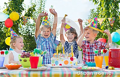 Group of kids having fun at birthday party Stock Photo