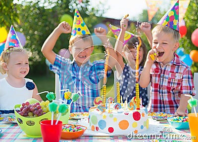 Group of kids having fun at birthday party Stock Photo