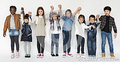 Group of Kids Holding Hands Face Expression Happiness Smiling on Stock Photo