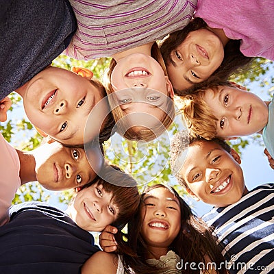 Group of kids outdoors looking down at camera, square format Stock Photo