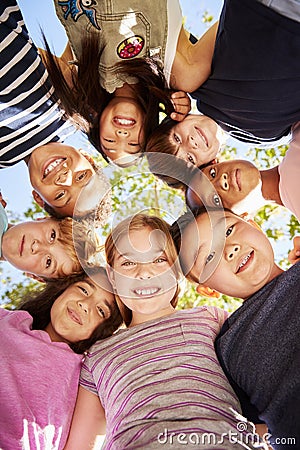 Group of kids outdoors looking down at camera,verticle Stock Photo