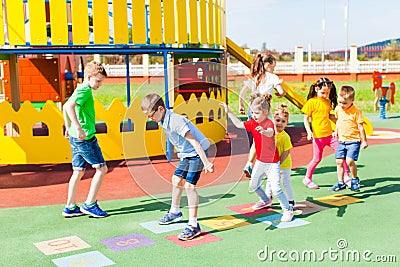 Group of kids play hopscotch Stock Photo