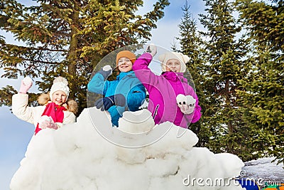 Group of kids play snowballs game together Stock Photo