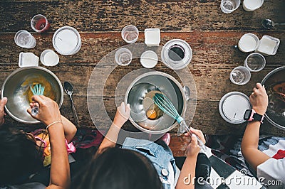 Group of kids are preparing the bakery in the kitchen .Children learning to cooking cookies Stock Photo