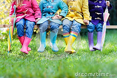 Kids in rain boots. Foot wear for children. Stock Photo