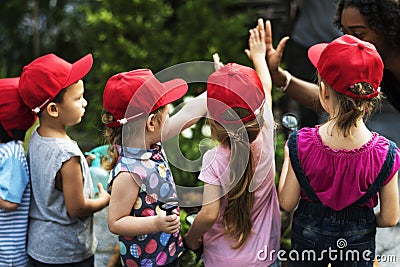 Group of kids school field trips learning outdoors active smiling fun Stock Photo