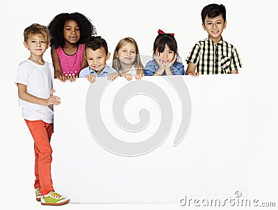 Group of Kids Showing Copyspace Board Stock Photo