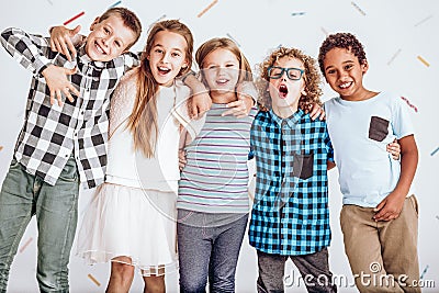 Group of kids standing in a row Stock Photo