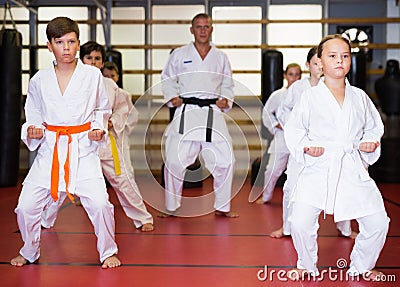 Kids at taekwondo workout, training attack movements Stock Photo