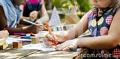 Group of kindergarten kids friends drawing art class outdoors Stock Photo