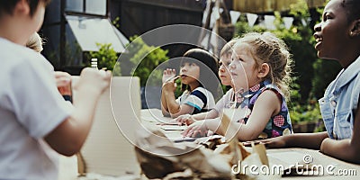 Group of kindergarten kids friends drawing art class outdoors Stock Photo