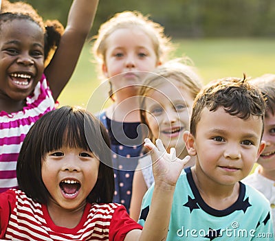 Group of kindergarten kids friends playing playground fun and sm Stock Photo