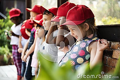 Group of kindergarten kids learning gardening outdoors field trips Stock Photo