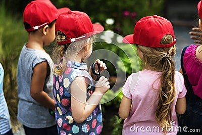 Group of kindergarten kids learning gardening outdoors field trips Stock Photo