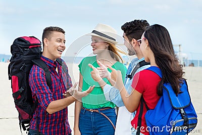 Group of laughing american backpacker and tourists Stock Photo