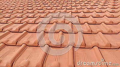 A Group of Light Brown Ceramic Roof Tiles Stock Photo